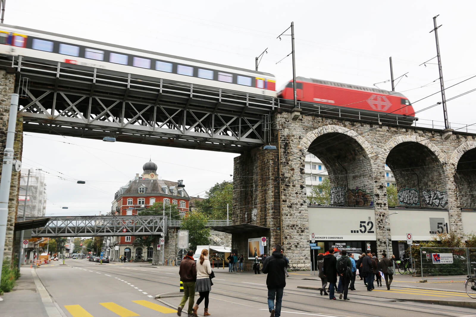 Im Viadukt Shopping Mile with SBB Train Crossing in Zürich, Switzerland