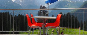 Swiss Restaurant with Orange Chairs