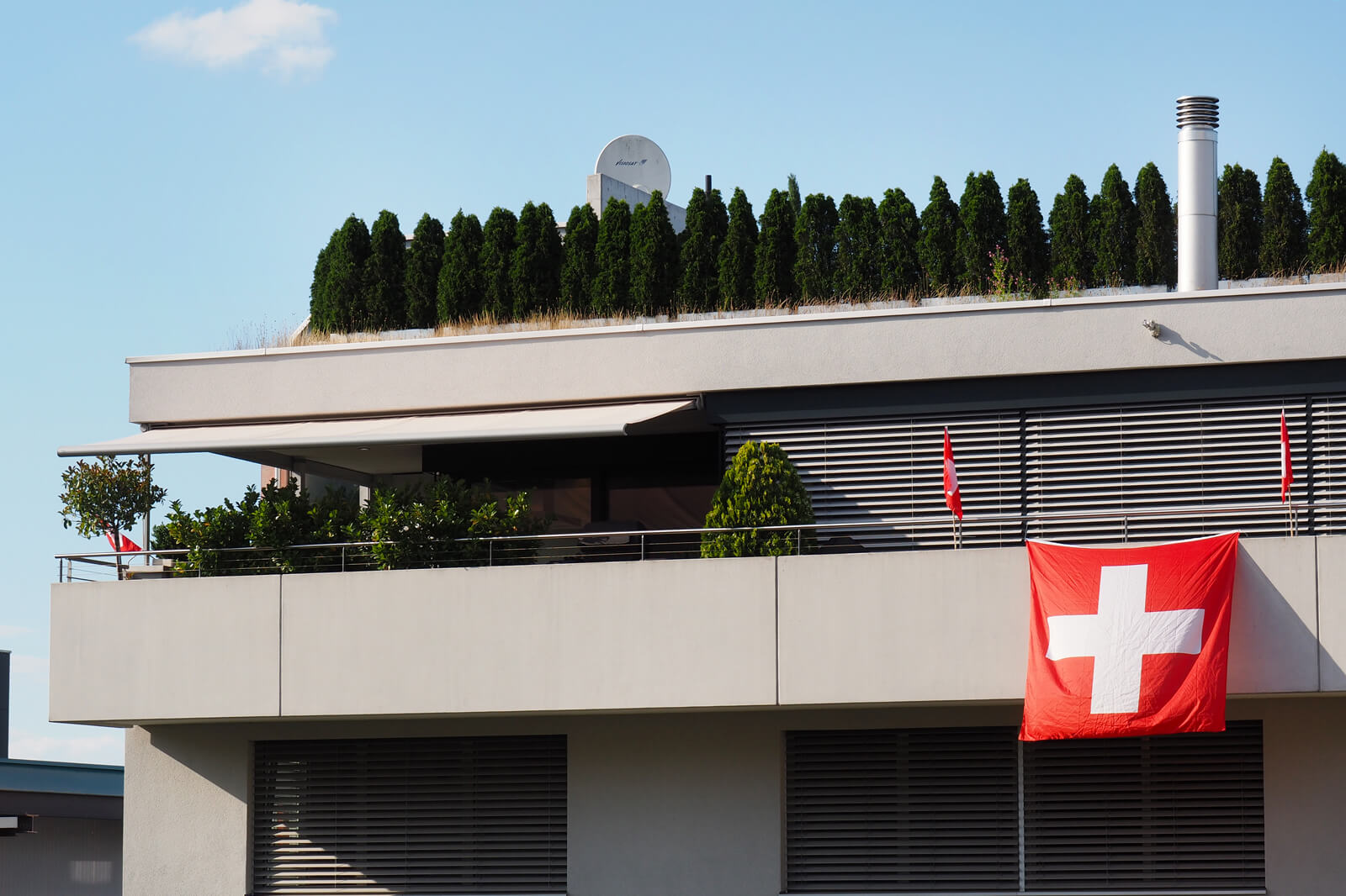 Swiss Flag Outside Apartment in Switzerland