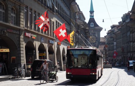 A Swiss flag waving in the Old Town of Bern, Switzerland