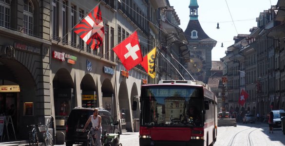 A Swiss flag waving in the Old Town of Bern, Switzerland