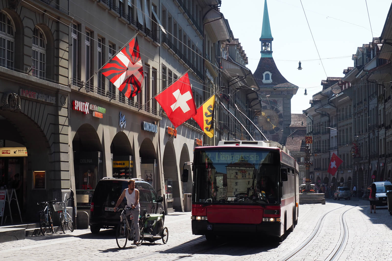 A Swiss flag waving in the Old Town of Bern, Switzerland