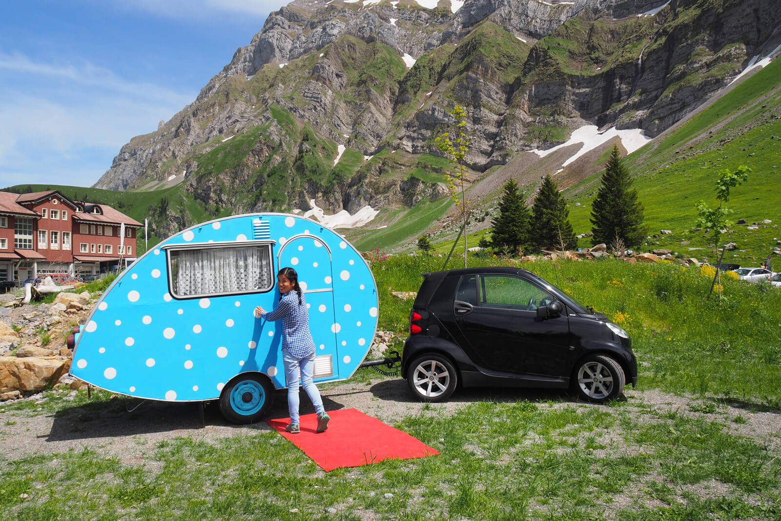 Smart car with tiny vintage trailer in Switzerland