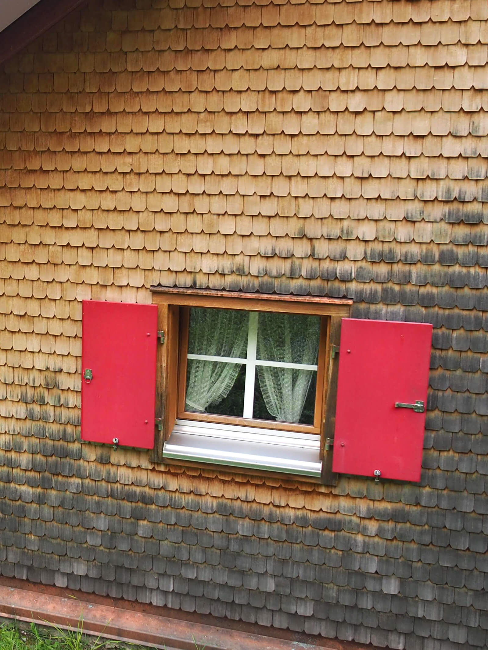 Swiss chalet with red shutters