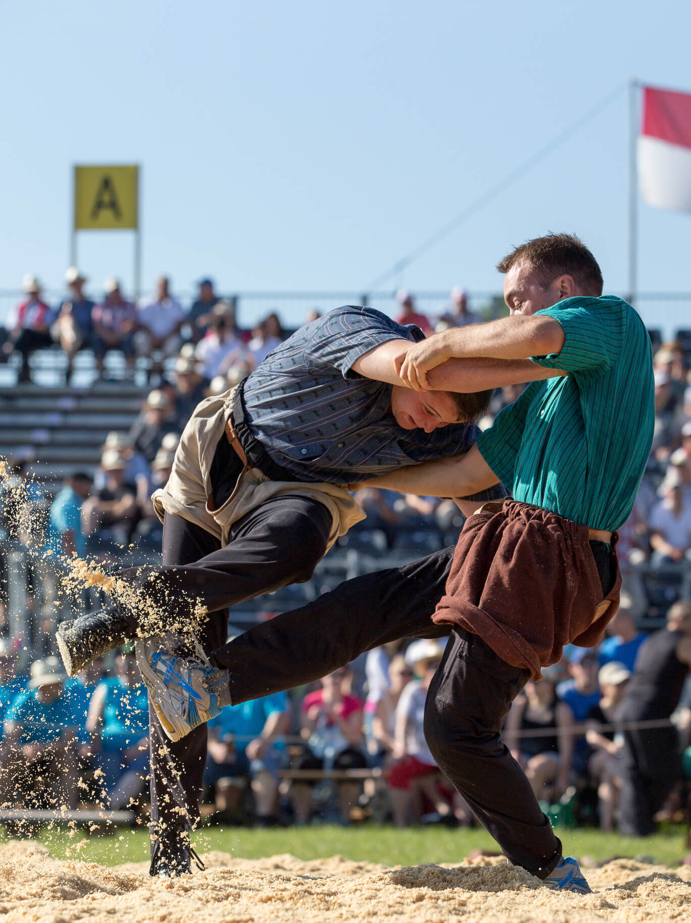 Swiss wrestlers fighting in the sawdust - Schwinger