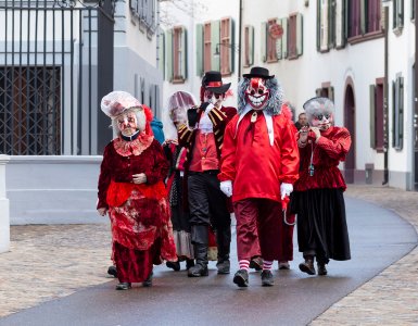 Carnival characters walking the old town of Basel during carnival