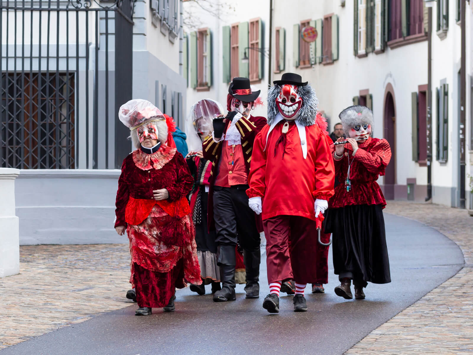 Carnival characters walking the old town of Basel during carnival