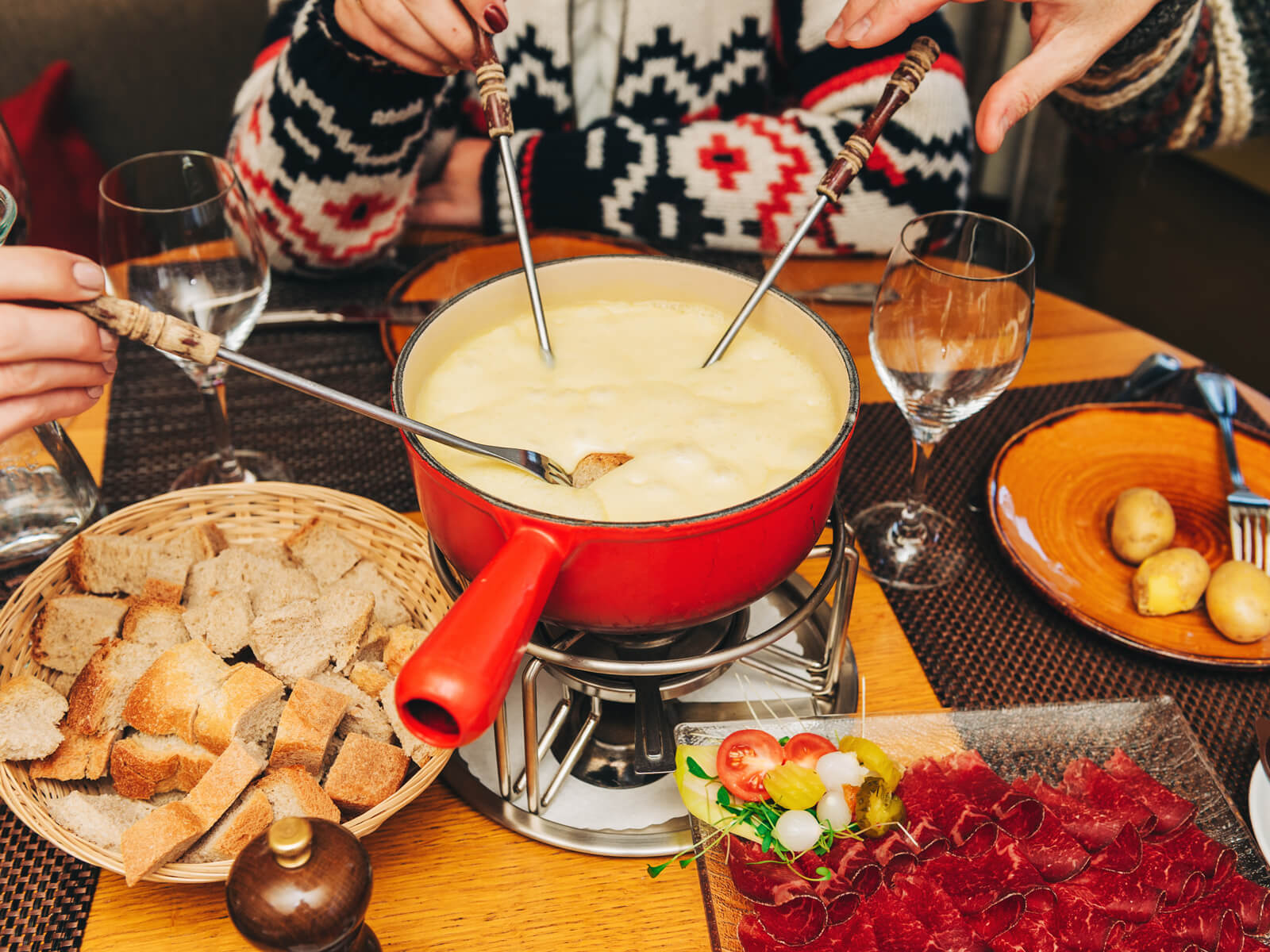 Cheese in Switzerland - A typical Swiss cheese fondue party