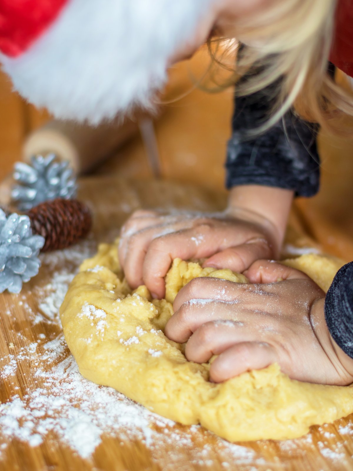 Christmas in Switzerland - Girl kneading Mailänderli dough