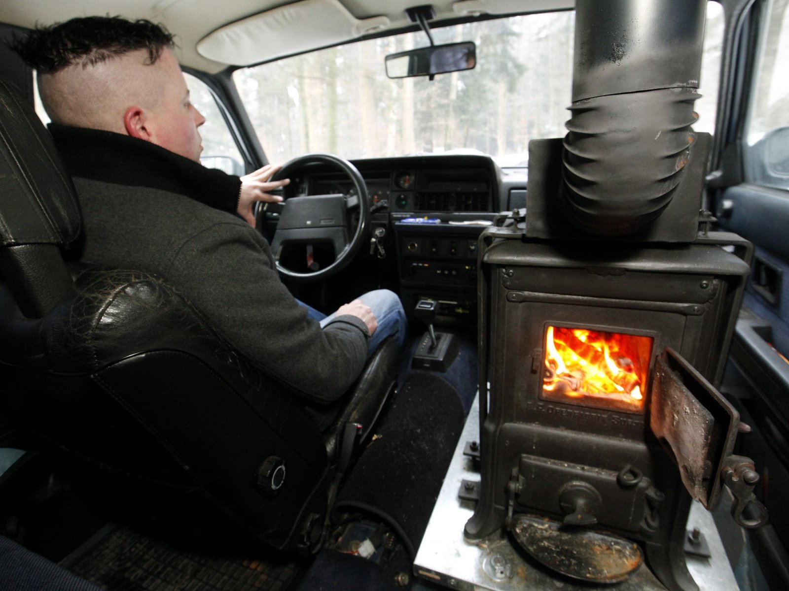 Swiss guy installs a wood-burning stove in his Volvo