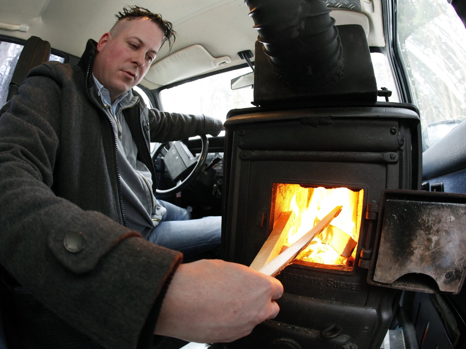 Swiss guy installs a wood-burning stove in his Volvo