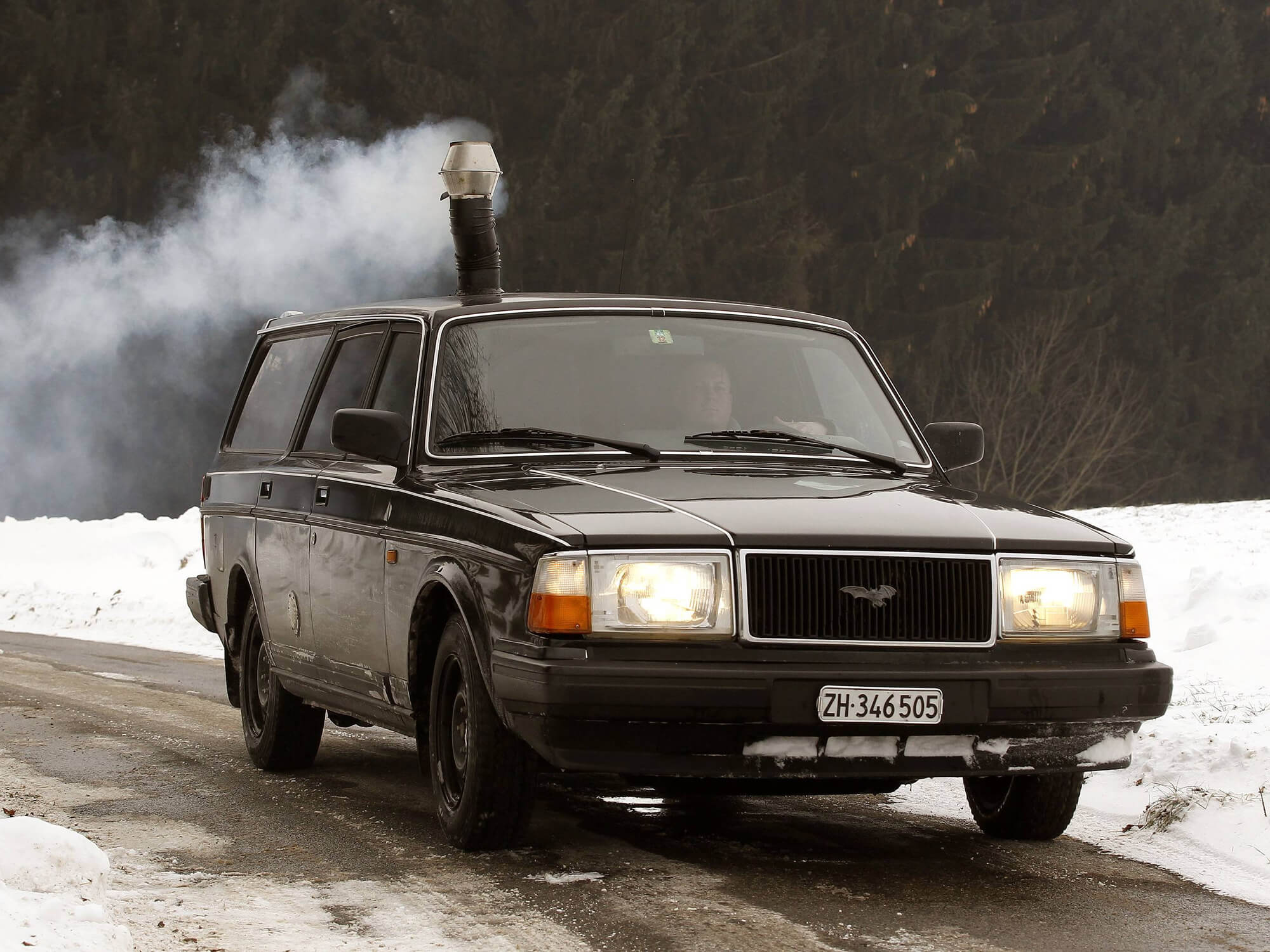 Swiss guy installs a woodburning stove in his Volvo Newly Swissed