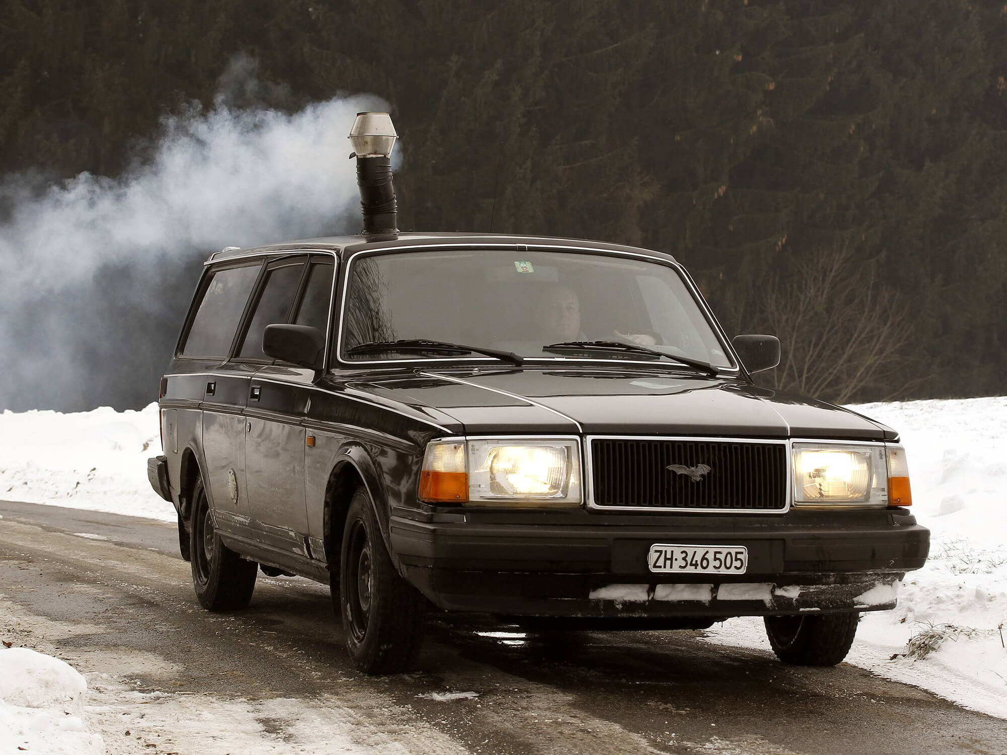Swiss guy installs a wood-burning stove in his Volvo