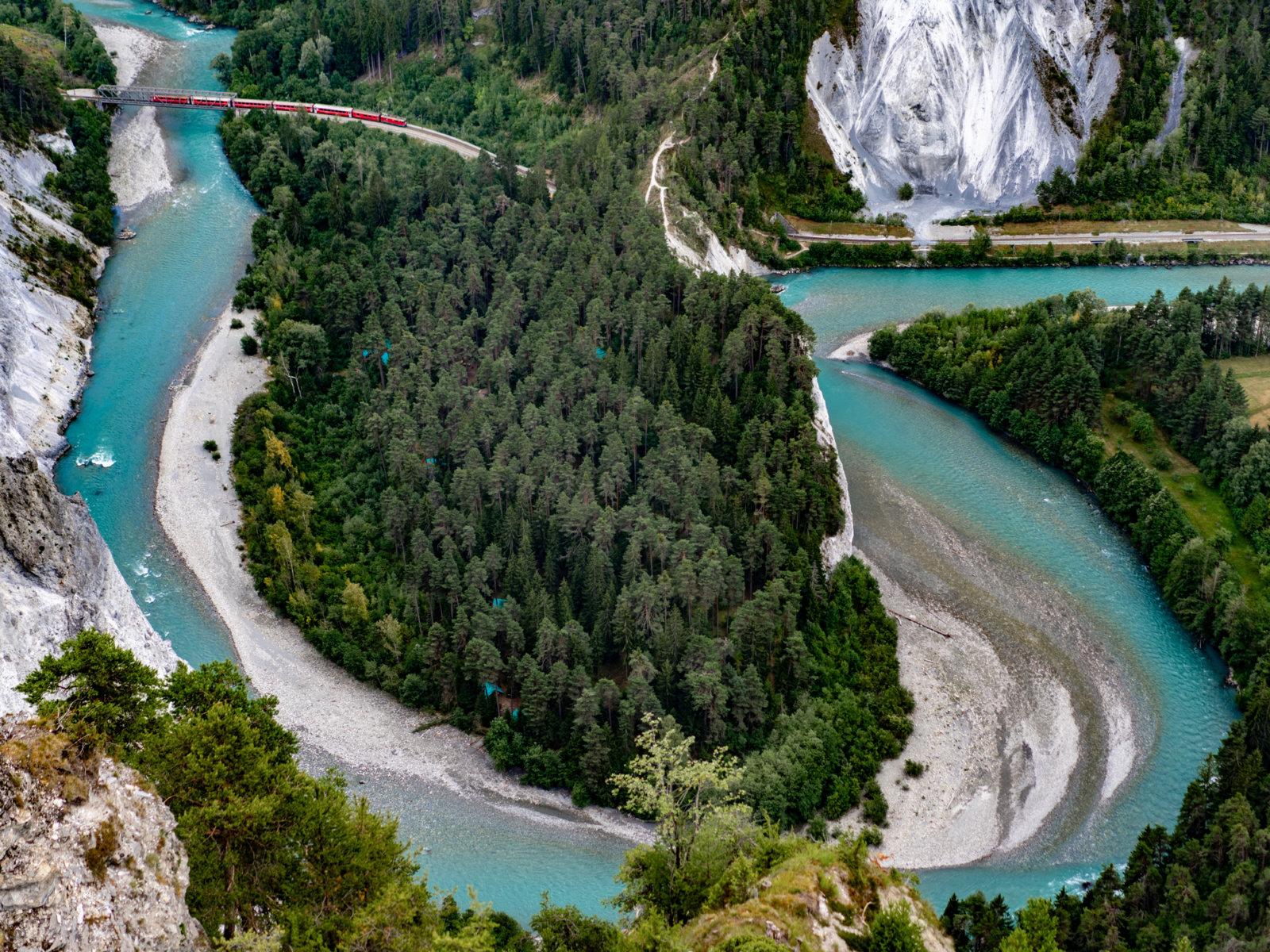 Sustainable Travel in Switzerland - Rhaetian Railways Train showing eco-friendly travel in Switzerland powered by hydroelectric power