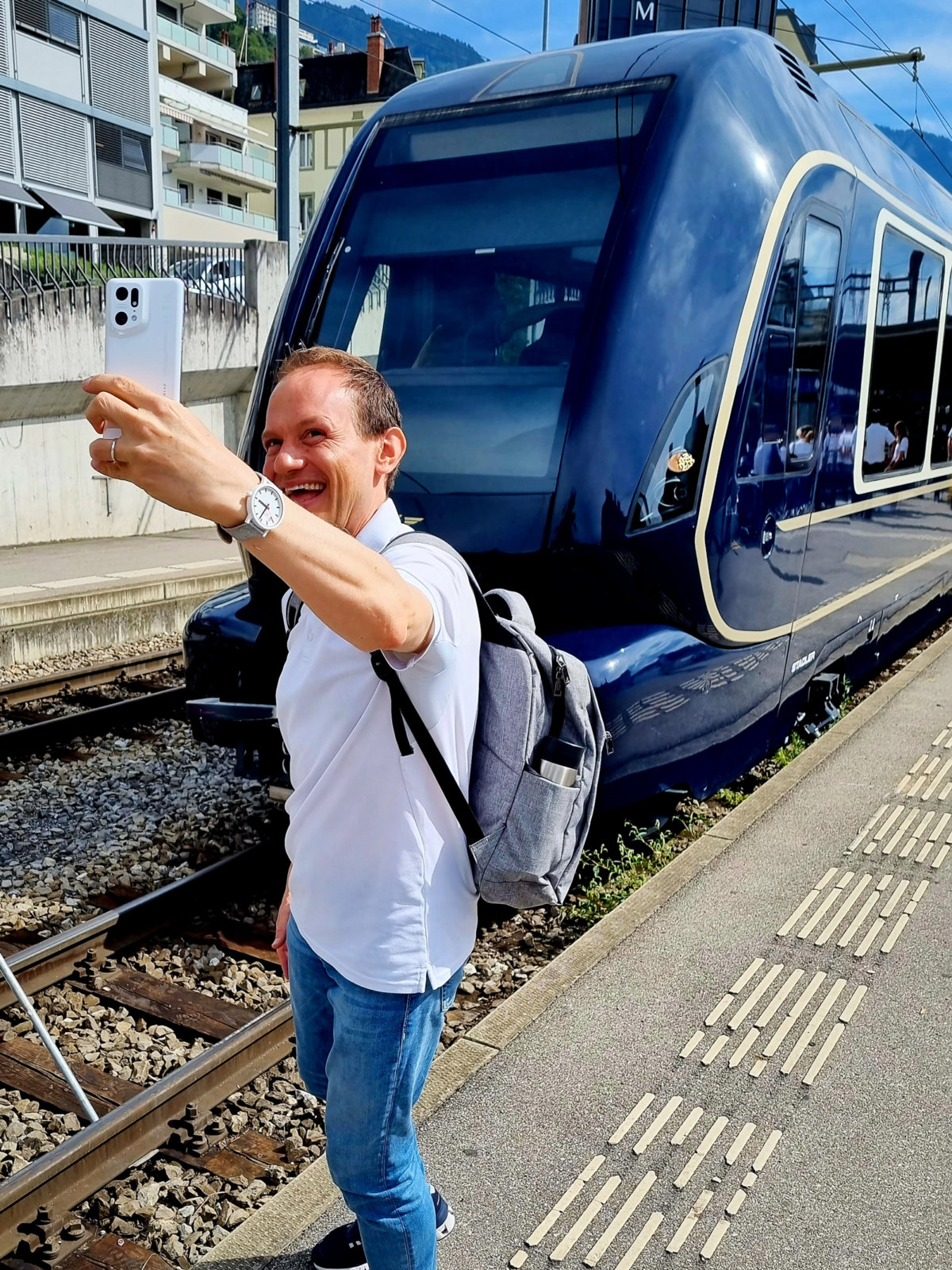 Dimitri Burkhard posing with the GoldenPass Express in Montreux