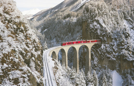 Swiss Travel Pass FAQs - Bernina Express Crossing Landwasser Viaduct in Winter