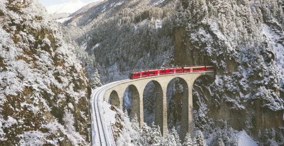 Swiss Travel Pass FAQs - Bernina Express Crossing Landwasser Viaduct in Winter