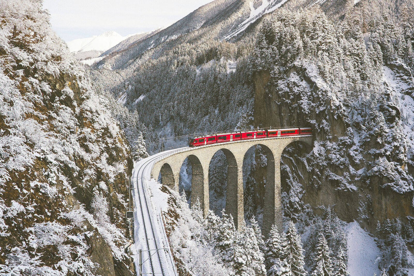 Swiss Travel Pass Bernina Express Crossing Landwasser Viaduct in Winter