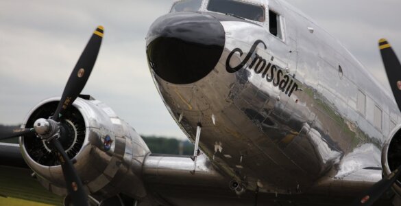 Vintage Swissair Posters - A classic Swissair aircraft featuring twin propellers on a cloudy day in Cambridgeshire.