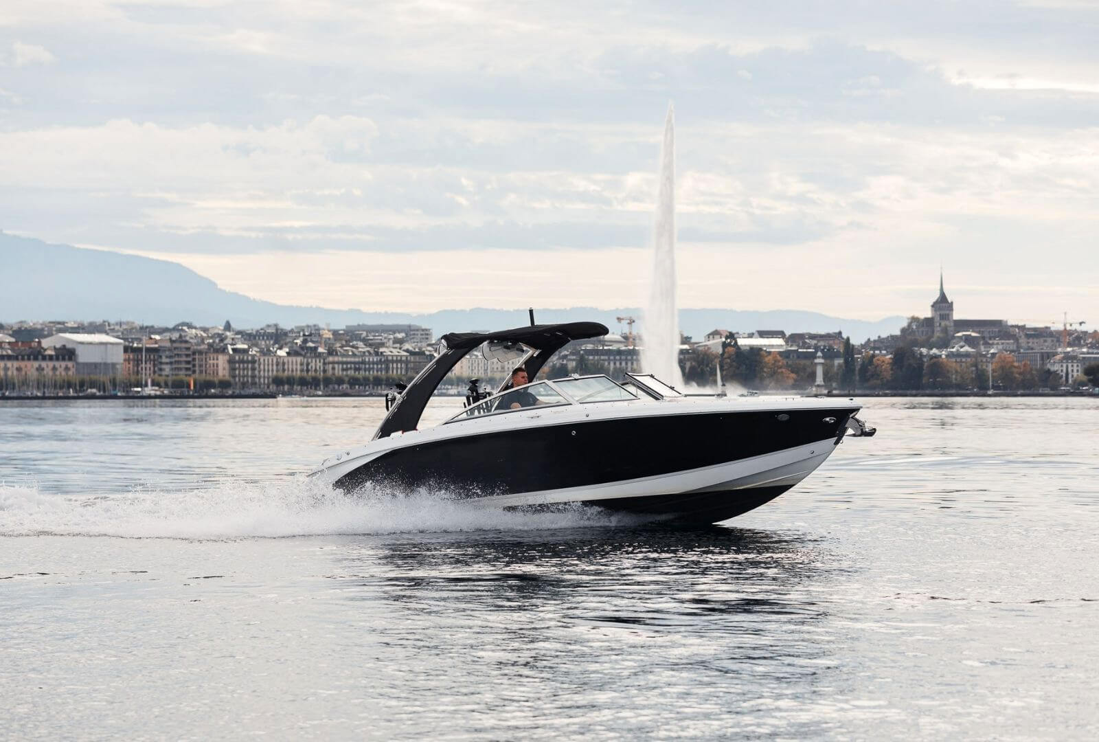 Genevaboats - Motor Boat speeding across Lake Geneva